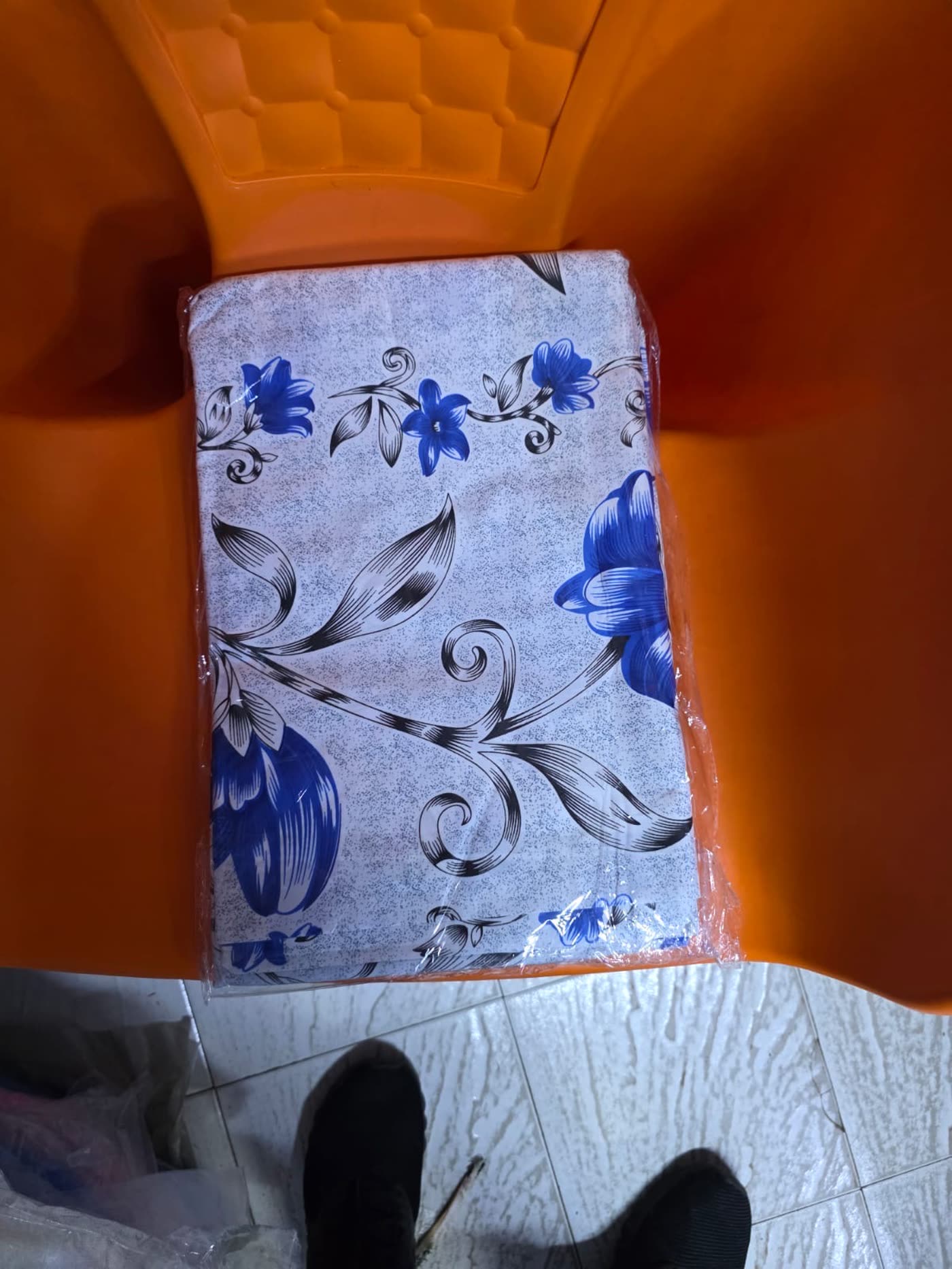 Folded pillowcase in a blue floral print